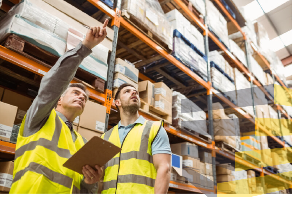 Stock photo from Canva of men in a warehouse representing people doing warehouse racking inspection