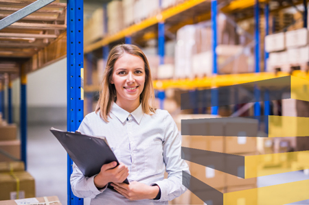 Stock image of a person holding a clipboard in warehouse representing a warehouse setup consultant